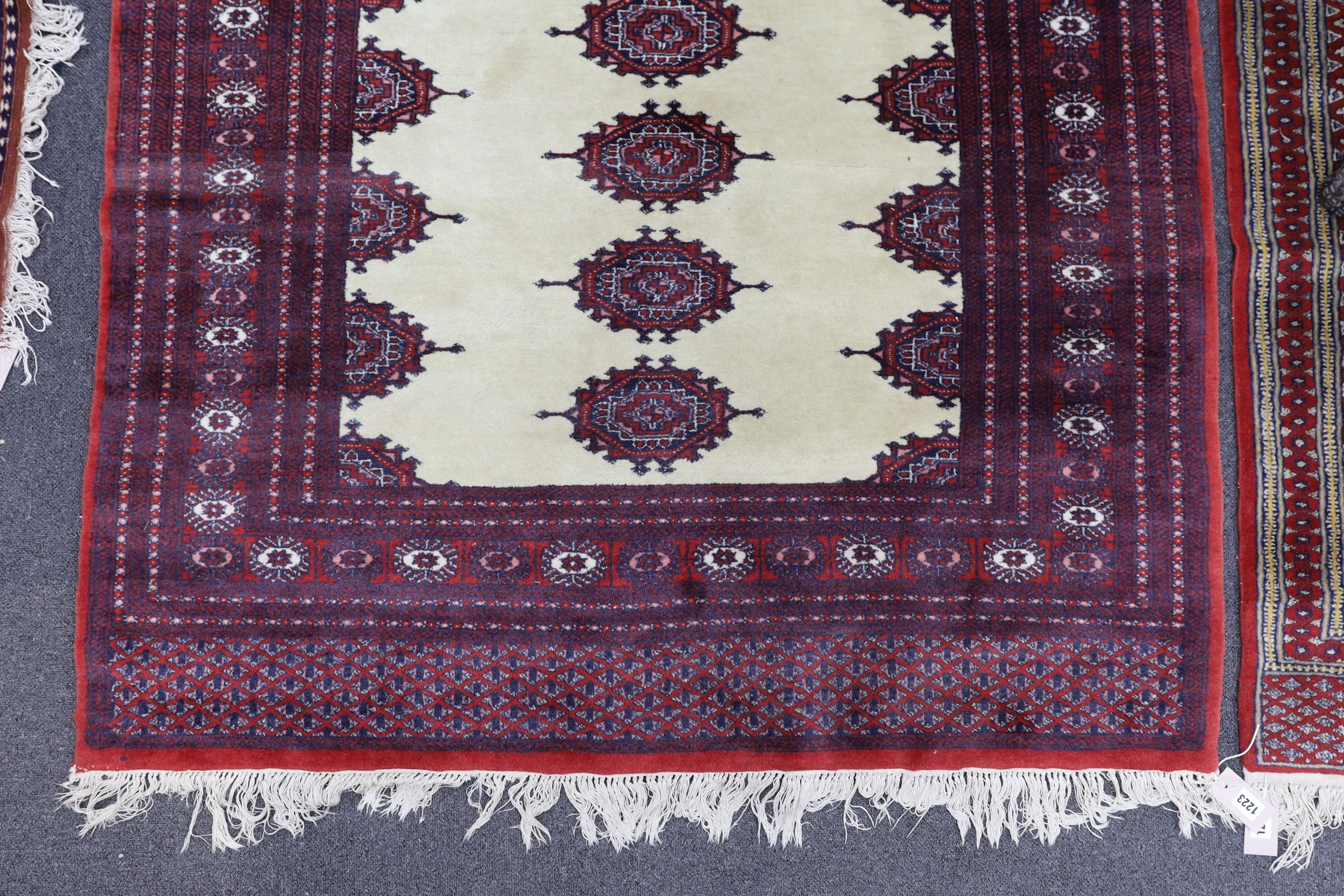 A Bokhara ivory ground rug, 190 x 125cm